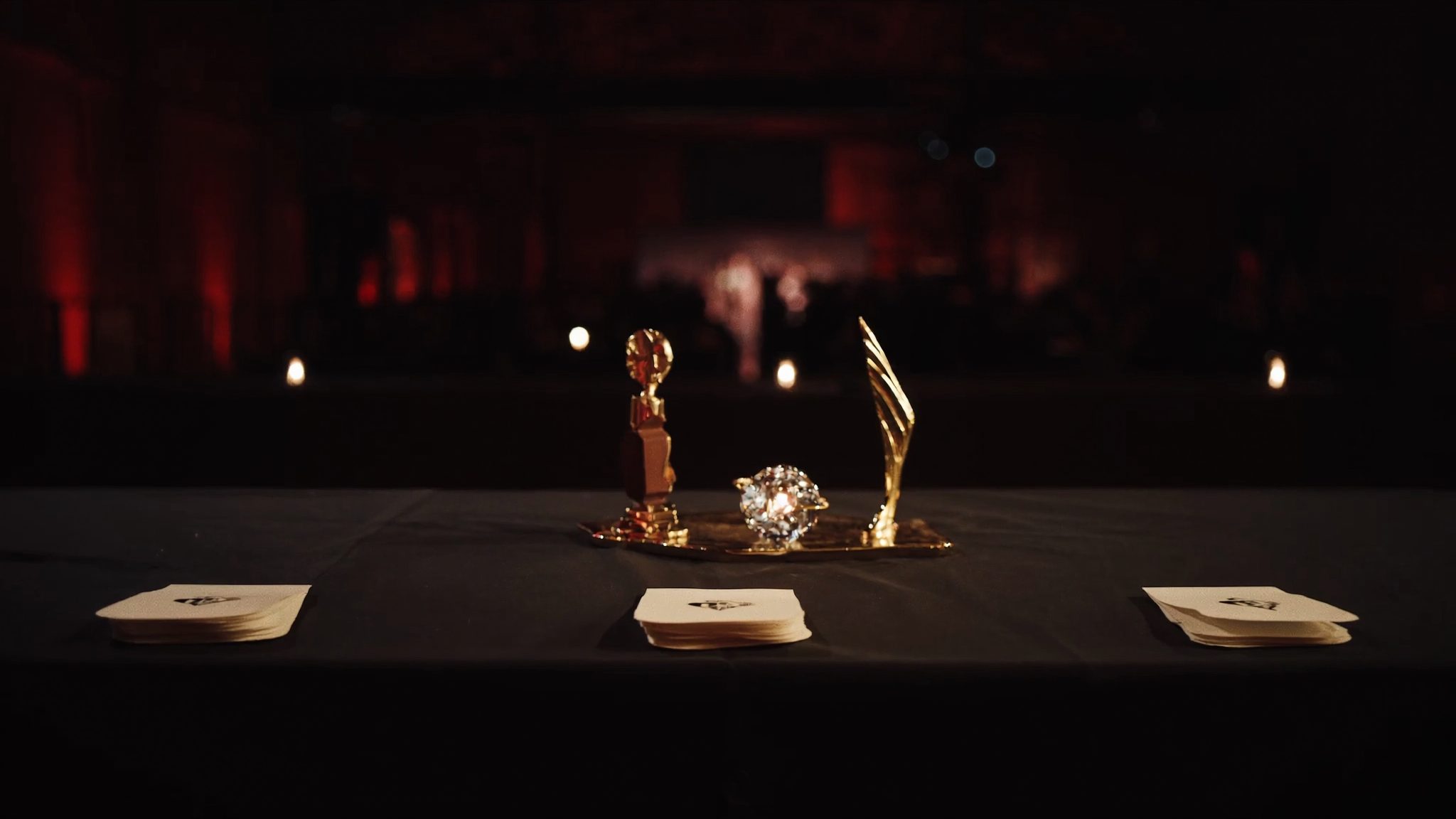 Kingdom Clash silent auction table with trophies and bid cards