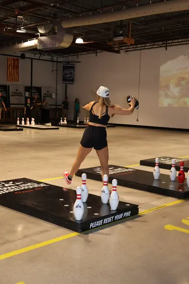 A player winds up a throw at a fowling lane