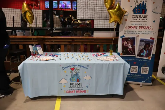 The Dream Factory table with a grant dreams banner