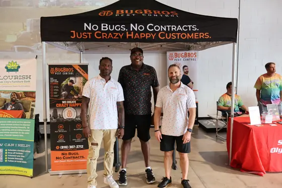 Three men in front of the BugBros tent