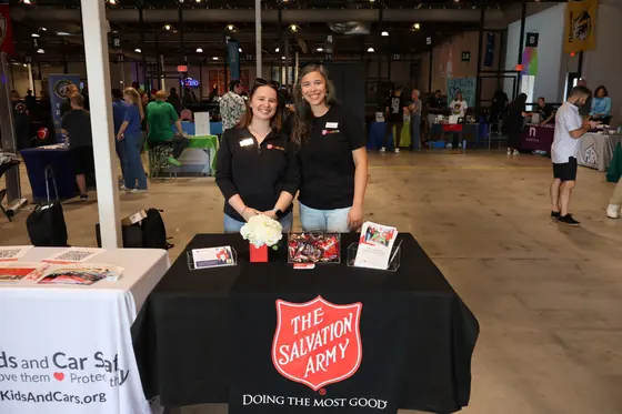 Two volunteers at The Salvation Army table