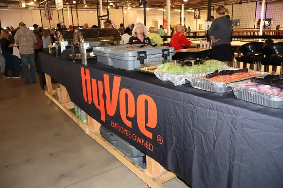 The Hy-Vee food table with trays of food