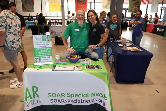 Volunteers at the SOAR Special Needs table