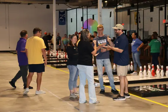 Players gathered and talking beside the lanes