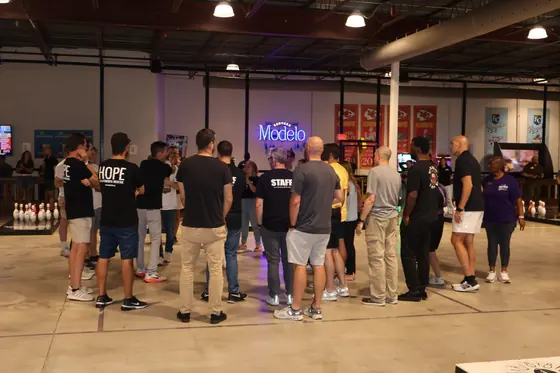 Players huddled together near the lanes