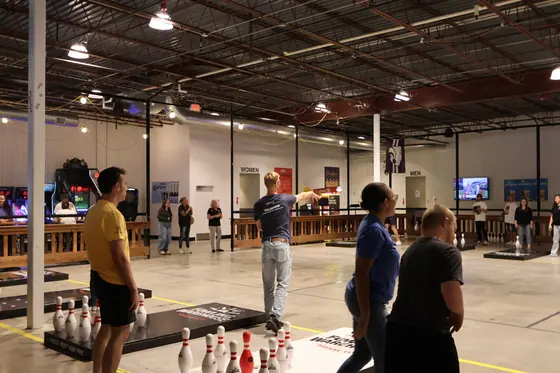 Players and spectators across the lane floor