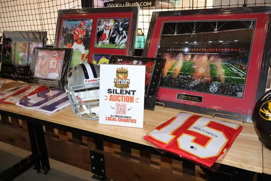 Framed sports memorabilia on display for the silent auction